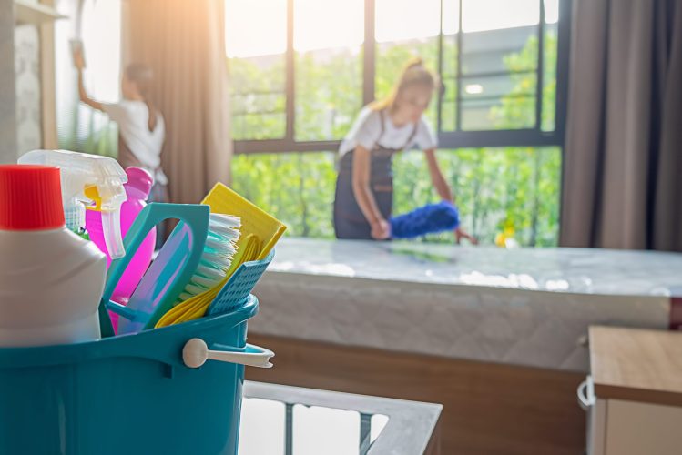 Professional cleaning service team working with cleaning equipment in room. Cleaning Service Concept. Professional cleaning service team working with cleaning equipment in room. Cleaning Service Concept.