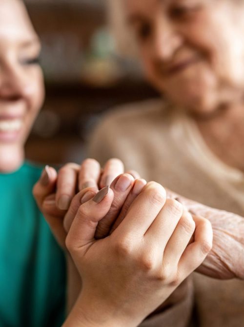 Cropped shot of a senior woman holding hands with a nurse Cropped shot of a senior woman holding hands with a nurse